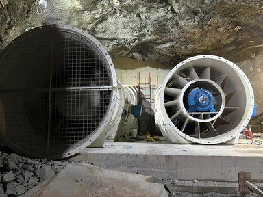 Emaar Liwa workers in hard hats and safety gear underground